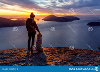 adventurous-girl-hiking-top-mountain-dog-adventurous-girl-hiking-top-mountain-dog-colorful-167580555